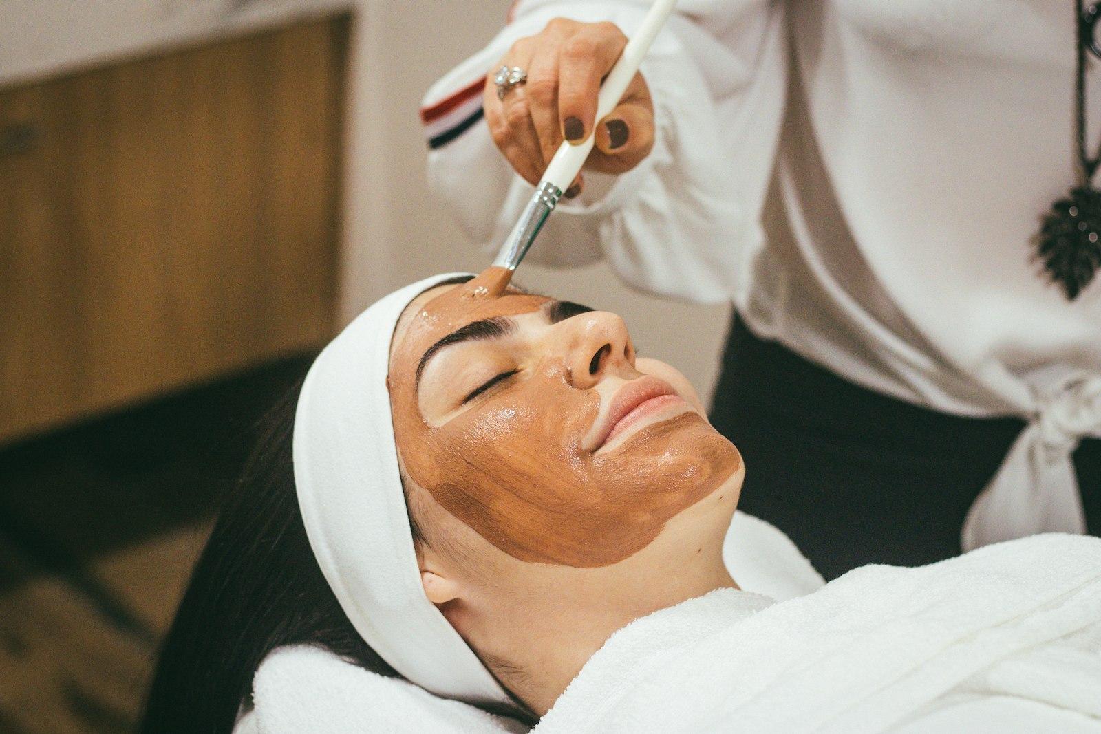 A facial mask being applied during a professional skin appointment